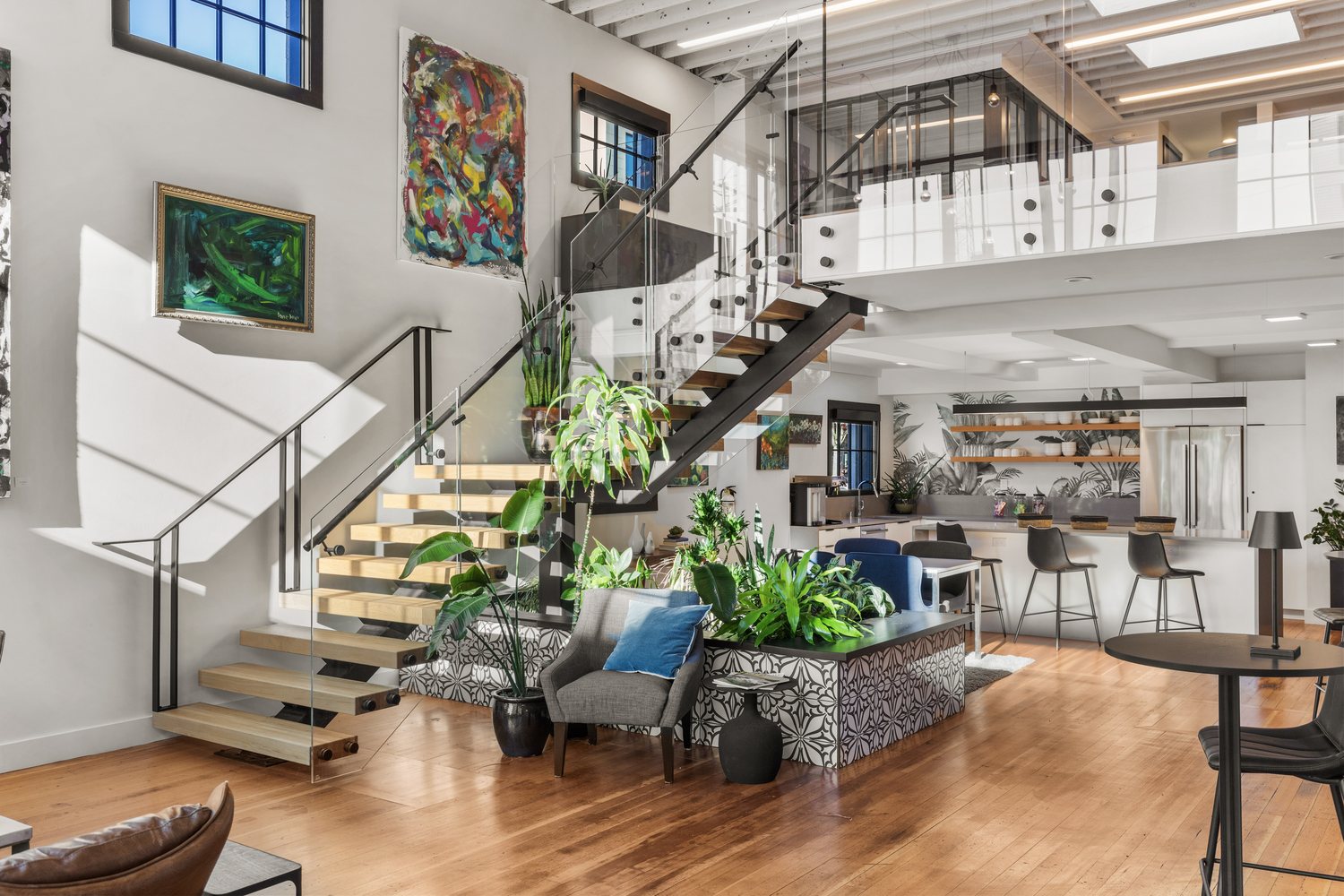 The open two-storey interior of the Capitol Hill office, with the staircase to the mezzanine